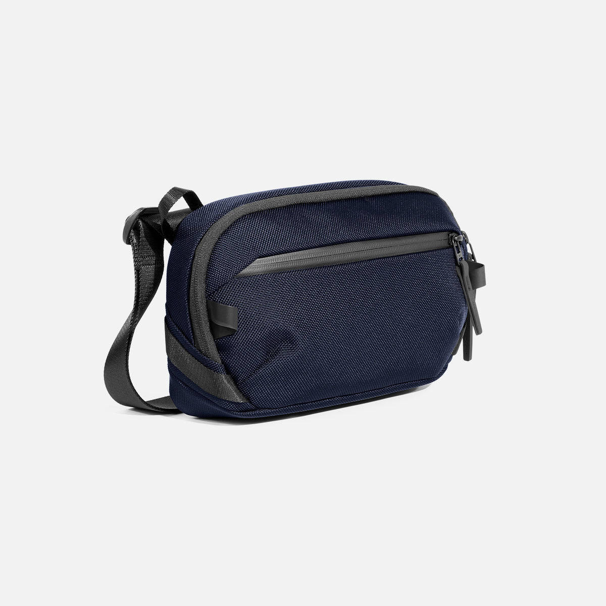 Aer Day Sling 4 product image - AER23072 1 daysling4 navy 34hero